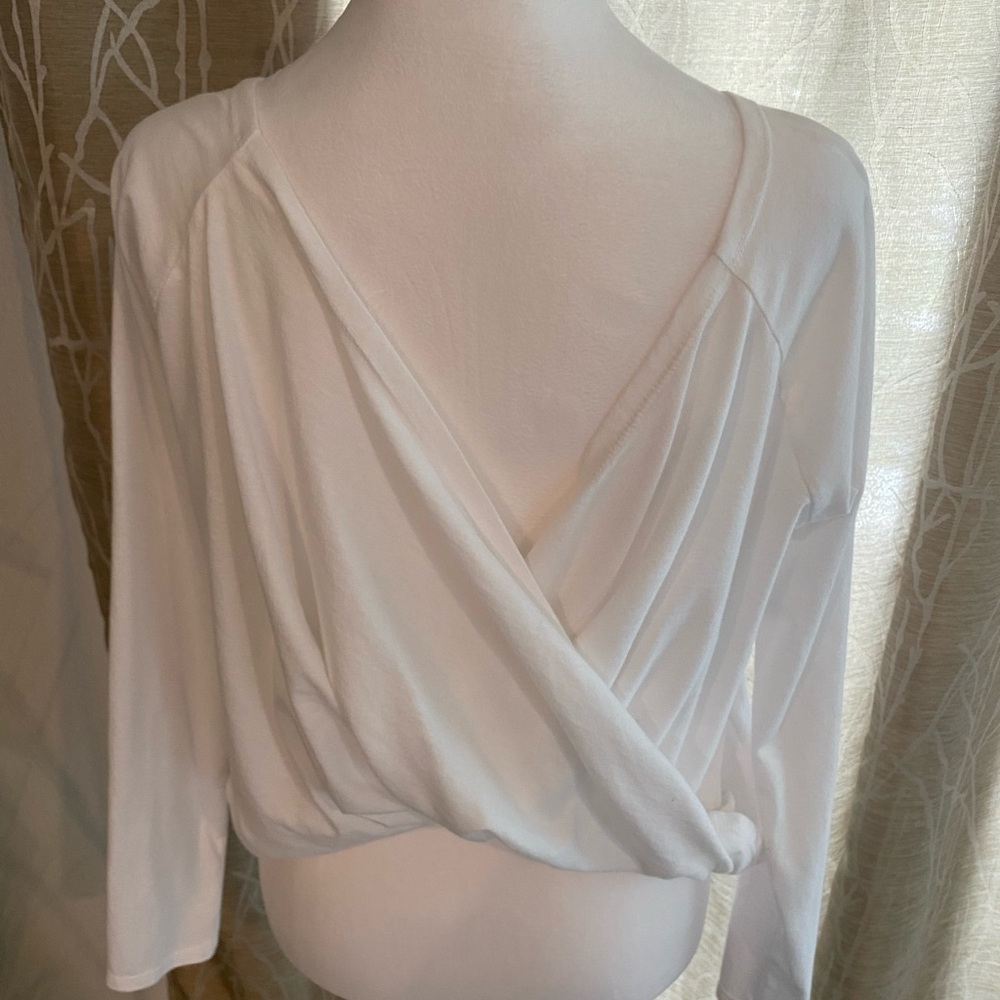 Fabletics white, very light sporty top with a fun draped back. Size S
